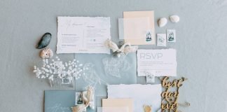 How to decline a wedding invitation politely, with wording examples Wedding invitation cards and envelopes arranged with flowers