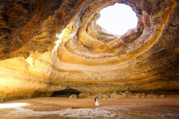 wedding couple in caves of Benagil algave
