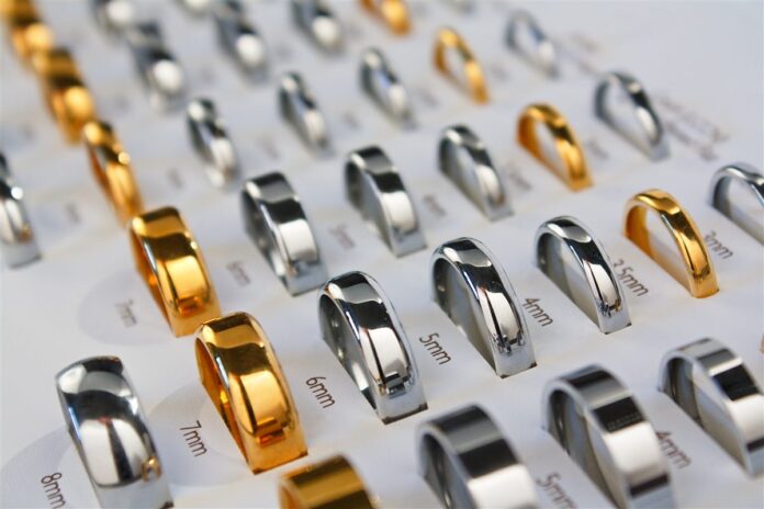 Gold and silver-coloured wedding bands displayed in different widths